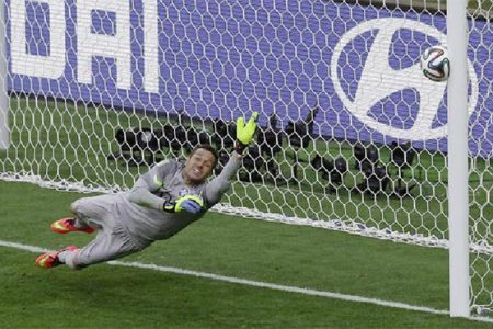 Brazil’s goalkeeper Julio Cesar dives as the decisive penalty shot by Chile’s Gonzalo Jara hits the goalpost in the penalty shootout during their 2014 World Cup round of 16 game at the Mineirao stadium in Belo Horizonte yesterday.
