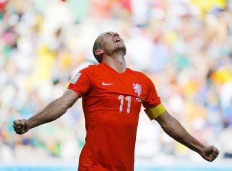 Arjen Robben of the Netherlands celebrates after winning their 2014 World Cup round of 16 game against Mexico at the Castelao arena in Fortaleza  yesterday. CREDIT: REUTERS/DOMINIC EBENBICHLER 