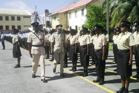 Acting Commissioner Seelall Persaud in the company of another senior officer inspecting the parade.
