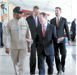 Flashback:  United States Assistant Secretary of State William Brownfield, second from right, chats with Inspector Matthew Ovid, left, head of the Canine Unit, at the Piarco International Airport during his visit to T&T in April, where he attended the Association of Caribbean Commissioners of Police Conference at the Hyatt Regency, Port-of-Spain. With them are Keith Gilges political chief, right, and James Story, director of International Western Hemisphere Programmes. PHOTO COURTESY US EMBASSY, PORT-OF-SPAIN 