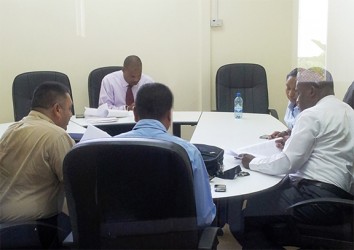 WICB vice president Emmanuel Nanthan (facing camera) meets with the Guyana Cricket Board at the Le Meriden Pegasus Hotel on Monday. Others in picture are Raj Singh, left backing camera, Anand Sanasie and Roysdale Forde.   