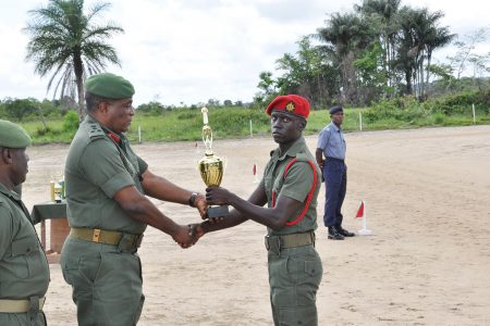Private Delroy Blackett (right) receiving his prize for the best performance at Camp Seweyo (GDF photo)