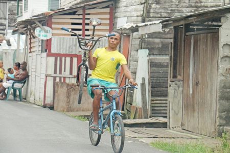 All in a day’s work – riding along James Street, Albouystown on Saturday.