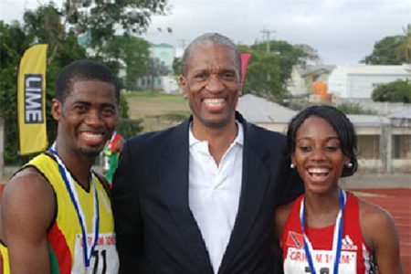 CARICOM Assistant Secretary General Dr. Douglas Slater (c) with the winners of the CARICOM 10K in Antigua/Barbuda – Cleveland Forde of Guyana, winner of the men’s event and Tonya Nero of Trinidad and Tobago, winner of the women’s event. 