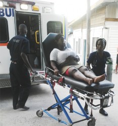 One of the 18 employees who were affected by the Qualfon power failure at its Goedverwagting building, being rushed into the Georgetown Public Hospital on May 20th.