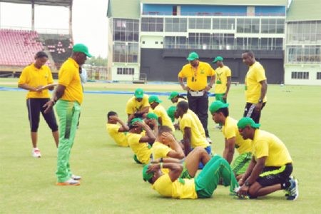  The U-19 players doing sit-ups under the watchful eyes of the senior players 