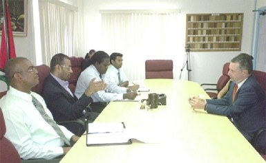 Minister of Natural Resources and the Environment, Robert Persaud (second from left) and Head of the Guyana Geology and Mines Commission, Rickford Vieira (left) meeting with Brazilian Ambassador,  Lineu Pupo de Paula (right). (GINA photo)