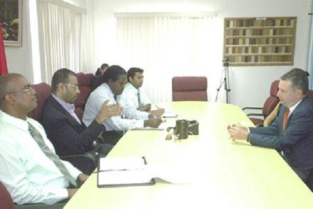 Minister of Natural Resources and the Environment, Robert Persaud (second from left) and Head of the Guyana Geology and Mines Commission, Rickford Vieira (left) meeting with Brazilian Ambassador,  Lineu Pupo de Paula (right). (GINA photo)