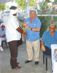 Not a hold-up: Patrick Pereira (centre) in 2010 at a Guyana Gold and Diamond Miners Association meeting demonstrating how new mining regulations would emasculate the industry. 