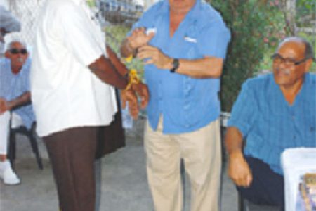 Not a hold-up: Patrick Pereira (centre) in 2010 at a Guyana Gold and Diamond Miners Association meeting demonstrating how new mining regulations would emasculate the industry.