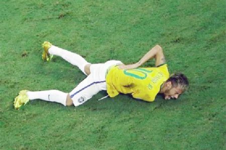 Brazil’s Neymar grimaces after a challenge by Colombia’s Camilo Zuniga (unseen) during their 2014 World Cup quarter-finals against Colombia at the Castelao arena in Fortaleza yesterday. REUTERS/Fabrizio Bensch