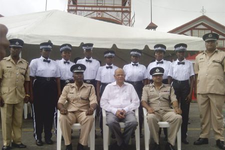 Minister of Home Affairs Clement Rohee being flanked on the right by acting Police Commissioner Seelall Persaud and Assistant Commissioner Balram Persaud and on the left by Traffic Chief Hugh Denhert and ‘A’ Division Commander Clifton Hickens with some of the new traffic wardens.
