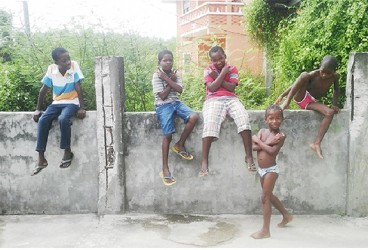 Young boys hanging out by the popular Bailey's shop in Belfield