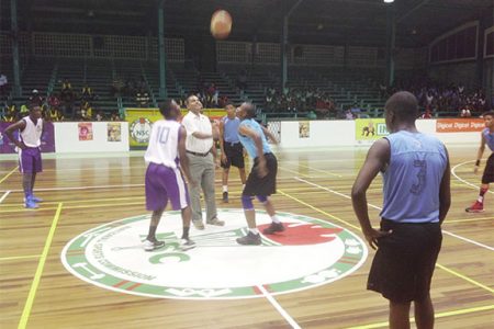 Minister of Culture, Youth and Sports, Dr Frank Anthony opening the tournament with the ceremonial jump ball