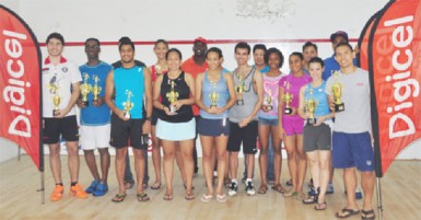 Alex Arjoon (right) in front row and Mary Fung-A-Fat (second from right) in front row pose with the other winners