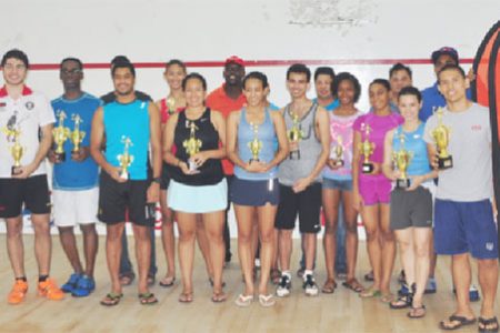 Alex Arjoon (right) in front row and Mary Fung-A-Fat (second from right) in front row pose with the other winners
