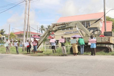 Plaisance residents turned out in modest numbers yesterday to protest in front of the Plaisance/Industry NDC