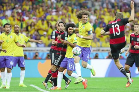 Thomas Mueller (2nd R) of Germany scores his team’s first goal during the 2014 FIFA World Cup Brazil Semi Final match between Brazil and Germany yesterday. (FIFA.com photo)
