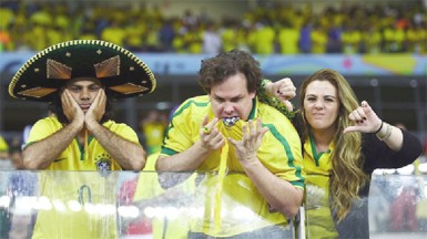 Emotional Brazil fans react after being defeated by Germany 7-1 during the 2014 FIFA World Cup Brazil Semi Final match between Brazil and Germany at Estadio Mineirao yesterday. (FIFA.com photo)