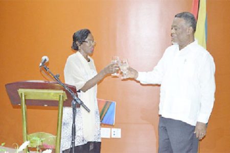 Prime Minister Samuel Hinds proposing a toast to Venezuelan Ambassador to Guyana Reina Arratia Diaz on the country’s 203 Independence Anniversary (GINA photo)