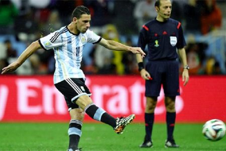 Maxi Rodriguez of Argentina scores in the penalty shootout to win the 2014 FIFA World Cup Brazil Semi Final match between Netherlands and Argentina at Arena de Sao Paulo yesterday in Sao Paulo, Brazil. (FIFA.com photo)