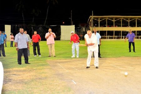 President Donald Ramotar facing the first ball to be played under floodlights at the Albion Sports Ground. (GINA photo)

