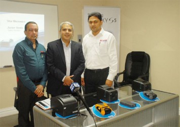 Starr Computer CEO Mike Mohan (left) and General Manager Rehman Majeed (right) with the visiting Star Micronics official