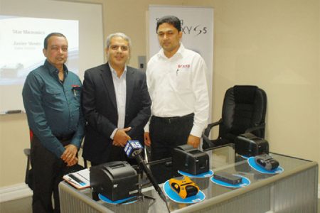 Starr Computer CEO Mike Mohan (left) and General Manager Rehman Majeed (right) with the visiting Star Micronics official