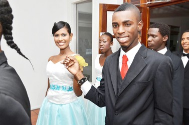 Mr Guyana Talented Teen 2014 Delroy Walcott (right) escorts contestant Lianna Williams at the Cotillion. 