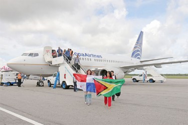 We’re here: Copa Airlines’ inaugural flight to Guyana touched down at the Cheddi Jagan International Airport, Timehri yesterday afternoon. Among the first passengers to disembark the plane was Geeta Maria Persaud, who carried the Golden Arrowhead as a tribute to her Guyanese father, Captain Krish Persaud, who was responsible for the training of over 60% of the pilots that operate the fleet of aircrafts flying under the Copa brand. (Arian Browne photo)