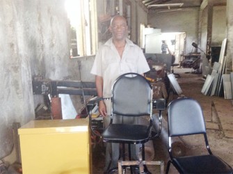 Businessman Ivor Bunbury with some of his furniture