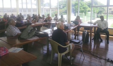 Facilitator Rick Powers (front, left) and President of GASA Ivan Persaud (front, right) as the coaching clinic got underway.