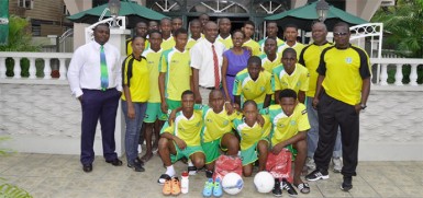 The National under-17 football team in a photo opportunity with president of the GFF, Christopher Matthias and members of the travelling contingent. 