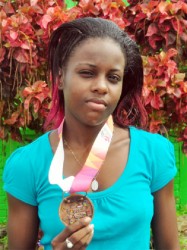 Jevina Sampson with her CAC bronze medal. (Orlando Charles photo) 