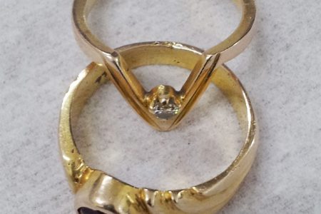 Gold rings with precious stones