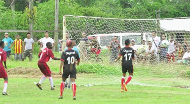 Bush Lot Secondary custodian Shane James making a critical penalty kick save from James Chand of Port Kaituma Secondary during his side’s 3-1 victory.  