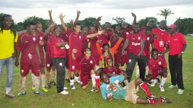 The victorious Region Five champs Bush Lot Secondary posing for a photo opportunity following their win over Region One title holders Port Kaituma Secondary.