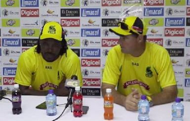 Jamaica Tallawahs skipper Chris Gayle (left) and Coach Mickey Arthur speaking yesterday during a press conference. (Clifton Ross photo)