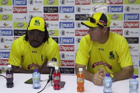 Jamaica Tallawahs skipper Chris Gayle (left) and Coach Mickey Arthur speaking yesterday during a press conference. (Clifton Ross photo)