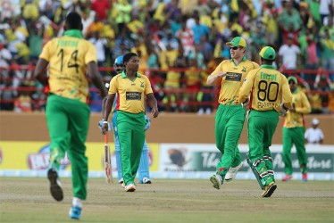 Guyana Amazon Warriors celebrate a Krishmar Santokie wicket on the way to a convincing win over the St Lucia Zouks at the Guyana National Stadium, Providence yesterday. (Getty Images)