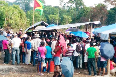 Hundreds of squatters gathered around the makeshift hall from which APNU MP Joseph Harmon addressed them (Photo by Chevy Devonish)
