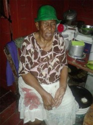 The dead man’s mother Ernestine Richmond with some of her son’s blood still soaked into her skirt. 