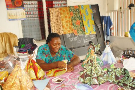 Patricia Helwig works on her African designs