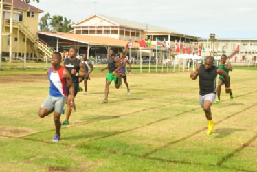 The meet’s fastest man, Tevin Garraway racing to victory in the men’s 100m Invitational ahead of Kevin Abbensetts and Kenneth Semple.(Orlando Charles photo)