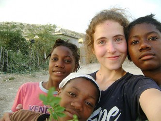 Morgan Wienberg with some of the orphans she worked with in Haiti. (Yukon News) 