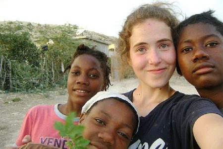 Morgan Wienberg with some of the orphans she worked with in Haiti. (Yukon News)

