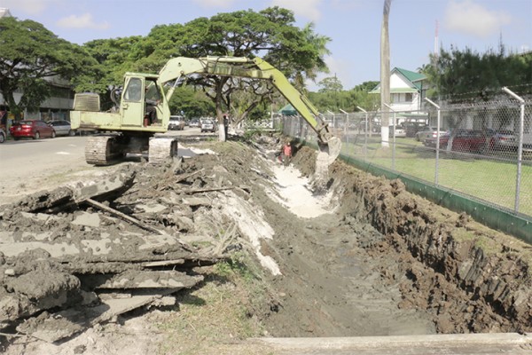 Under construction: Getting ready to lay the foundation for concrete drains around the Ministry of Agriculture, Regent Street. (Photo by Arian Browne)