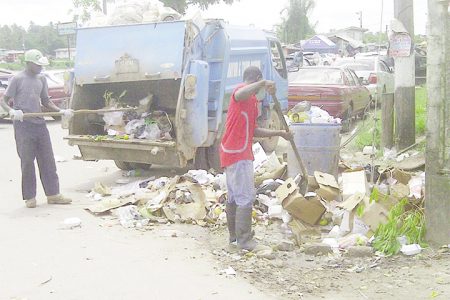 Linden Town Council employees removing refuse dumped outside of the Mackenzie Municipal Market
