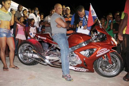 Size does matter! – Havin Ramnauth showcasing his $8M Suzuki 600 self-customized motorcycle which took first prize for the Best Super Bike category of the Lake Mainstay 5th Annual Car and Bike Show held at the Resort on Saturday.