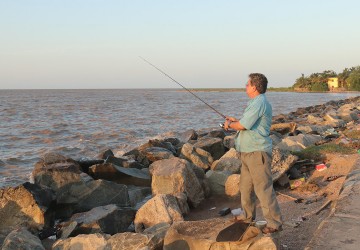 After a hard day’s work, Marcio says he likes fishing during the high tide at the Kingston Seawall. Sometimes he catches something, other times he doesn’t but the process helps to clear his mind.